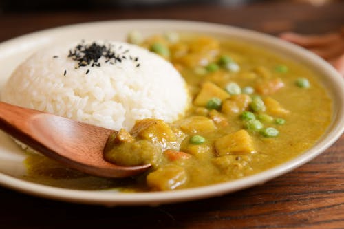 Cooked Rice and Curry Food Served on White Plate